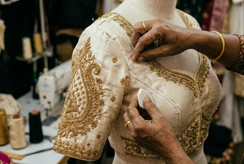 Bridal blouse fitting session with tailor measuring and adjusting