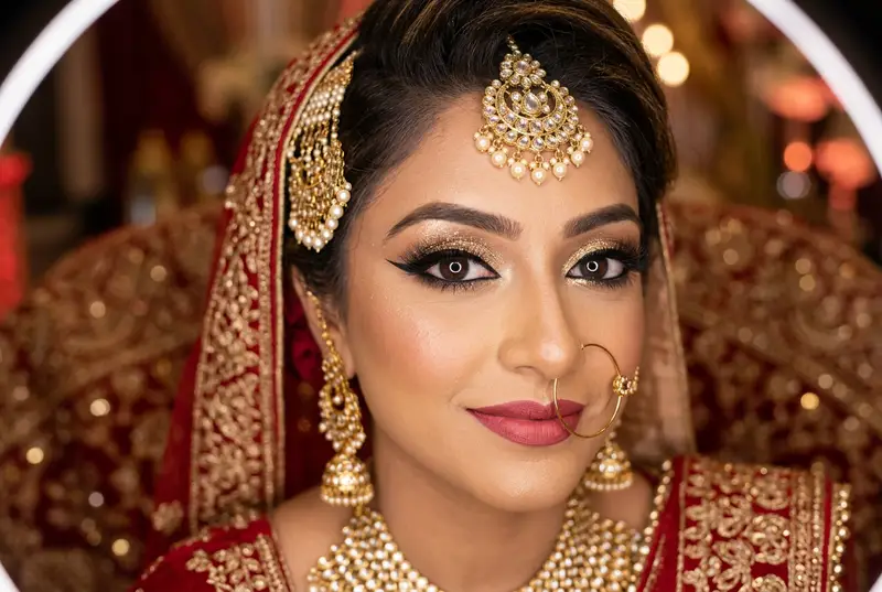 Close-up of Indian bridal eye makeup with gold smokey eye