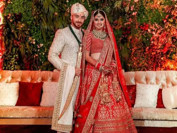Indian bridal lehenga styled by StyleBuddy Weddings — bride and groom in coordinated traditional outfits