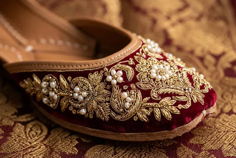 Ornate embroidered bridal juttis with gold thread and pearl work